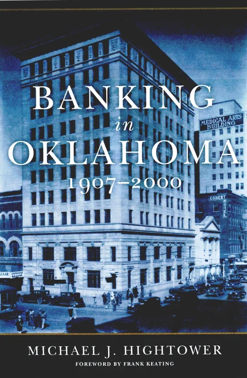 Book cover of “Banking in Oklahoma 1907–2000” by Michael J. Hightower, featuring a blue-tinted historical photograph of a grand downtown bank building surrounded by early 20th-century street activity